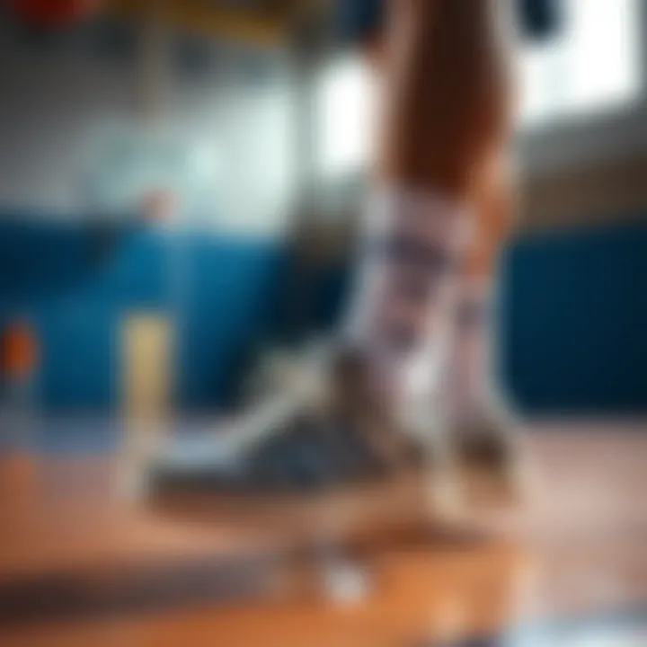 An athlete wearing Adidas Forum Low shoes on the basketball court.