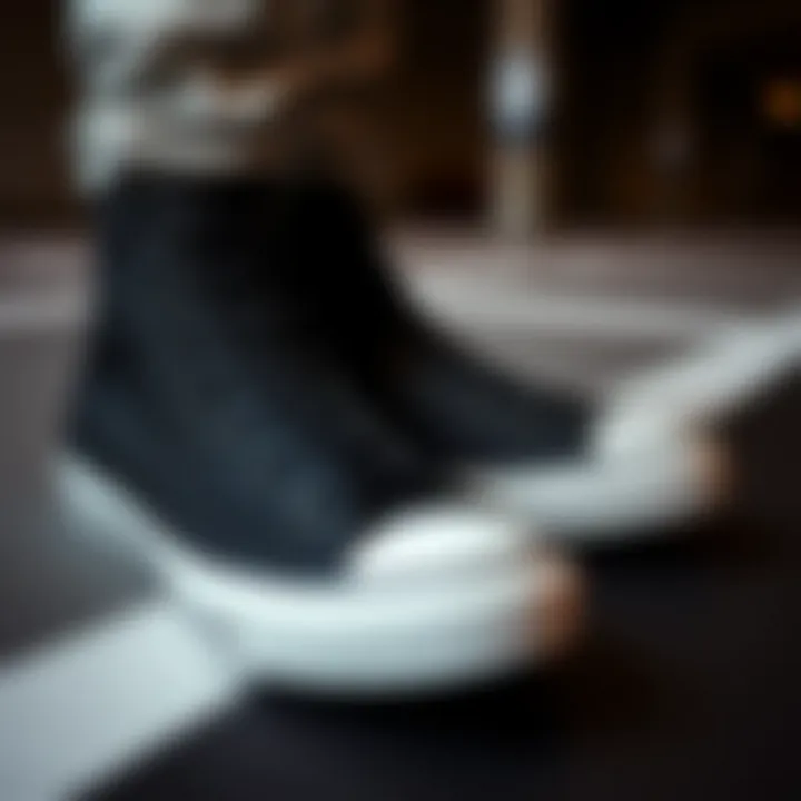 Sleek black high-top Converse shoes showcasing elegance and functionality