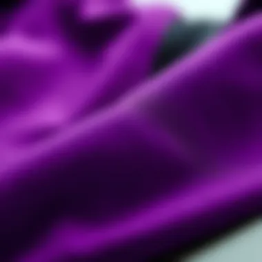 A close-up of fabric textures in purple and black clothing