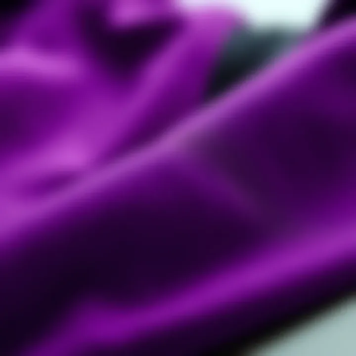 A close-up of fabric textures in purple and black clothing
