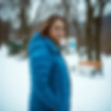 A woman enjoying a winter day wearing a chic blue goose down coat