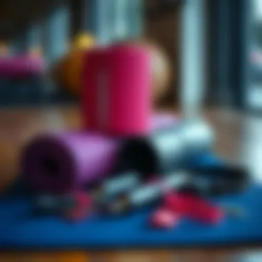 Yoga mat with essential Pilates accessories on display